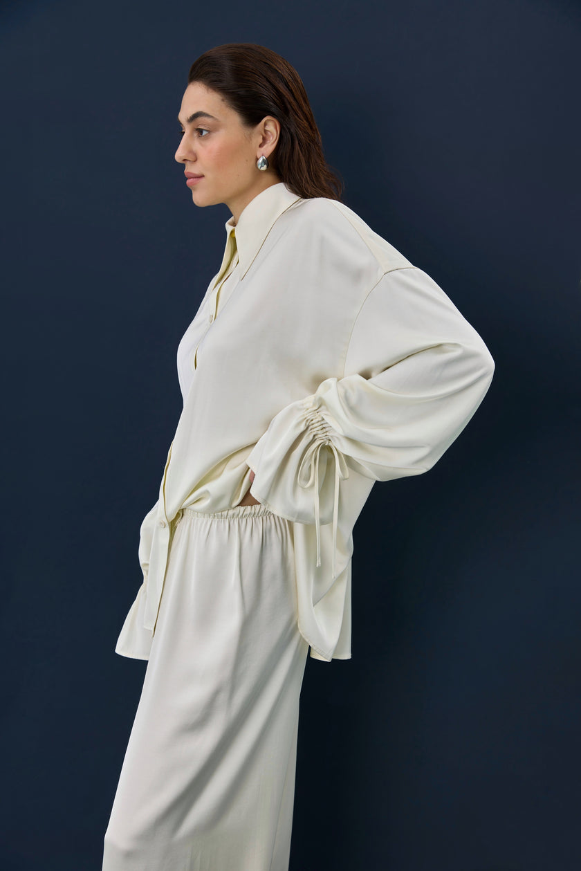 Штани сатинові молочні