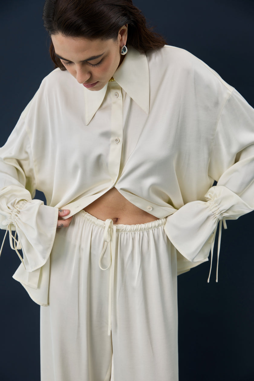 Штани сатинові молочні