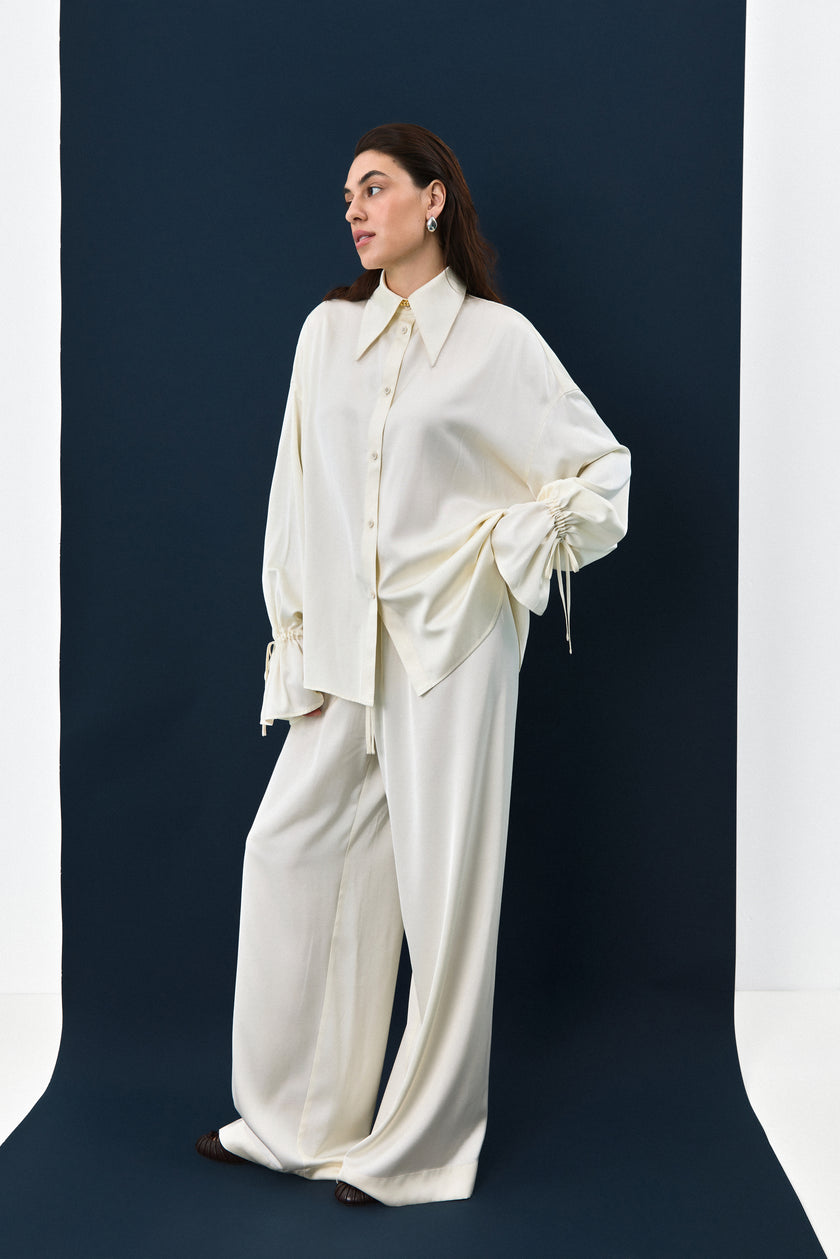 Штани сатинові молочні