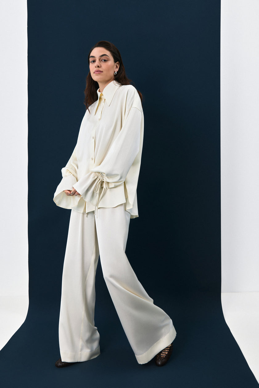 Штани сатинові молочні