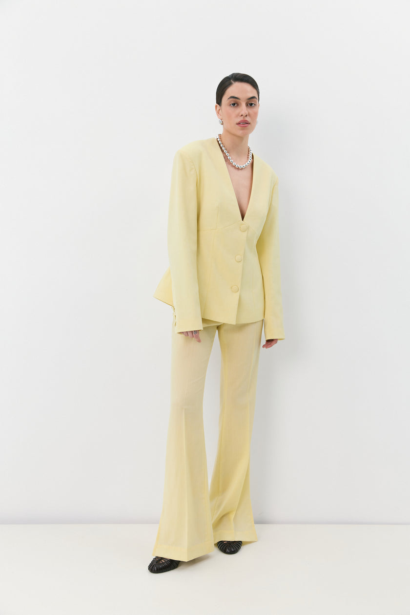 Жовті брюки кльош